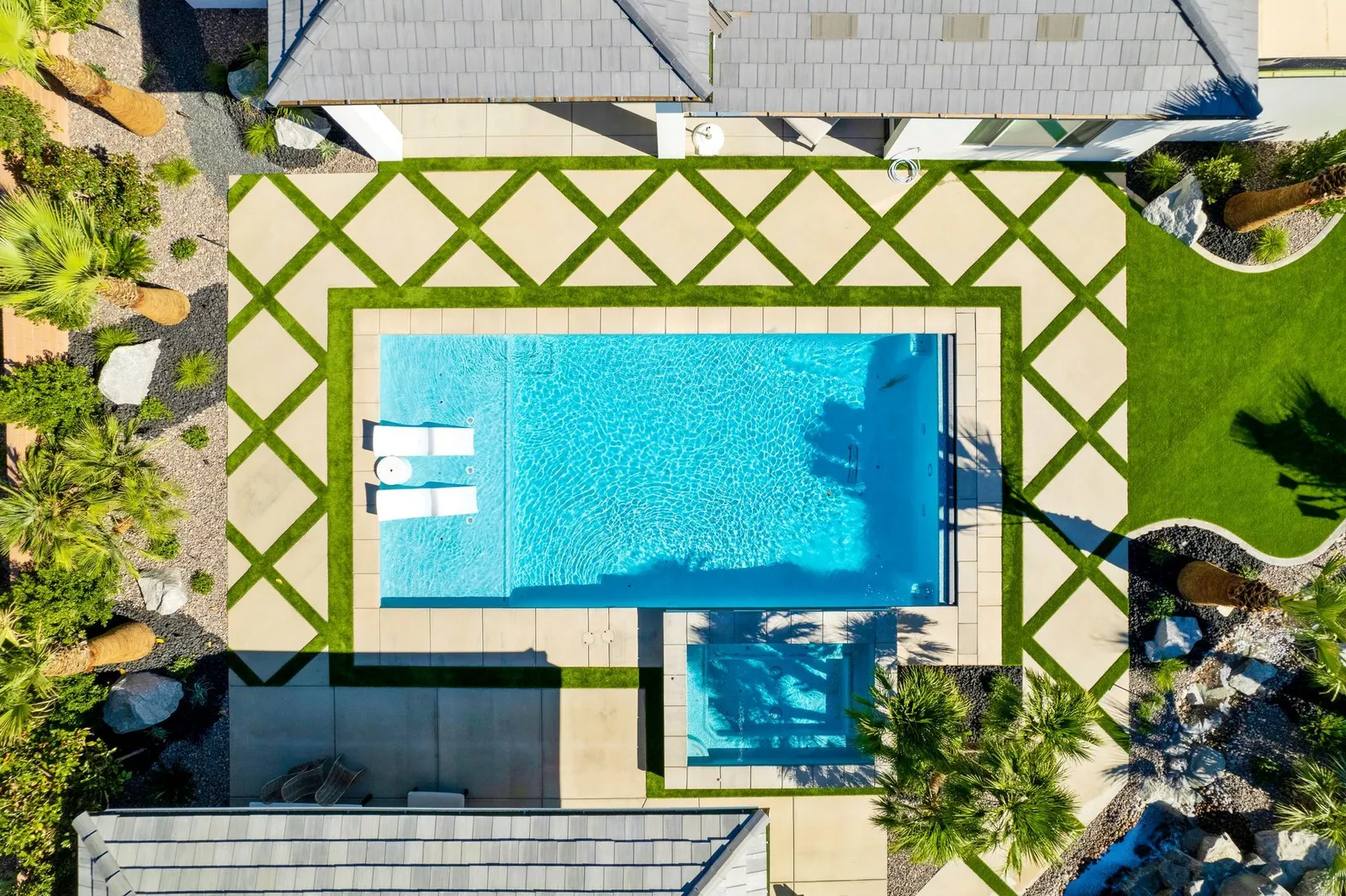 Aerial view of geometric pool and landscape design